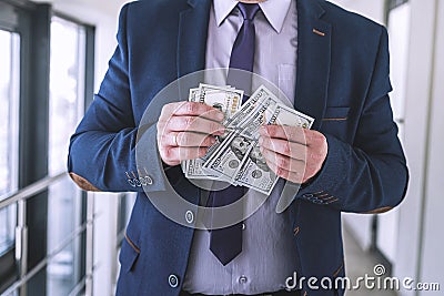 Ambitious business man in blue suit count us money Stock Photo