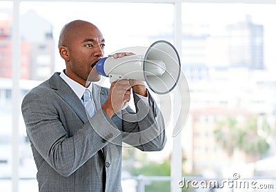 Ambitious businessman yelling through a megaphone Stock Photo