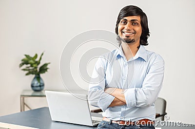 Ambitious and high skilled indian male entrepreneur stands in confident pose Stock Photo