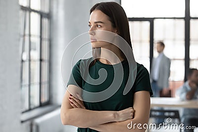 Ambitious strict businesswoman looking out the window thinking and planning Stock Photo