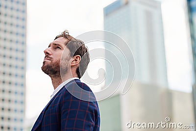 Ambitious young businessman with a vision standing in the city Stock Photo