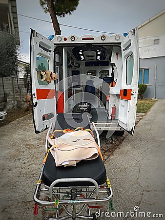 Ambulance stopped with the doors open and the stretcher empty Editorial Stock Photo