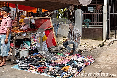 Ambulant shoe vendor at Terong Street Market in Makassar, South Sulawesi, Indonesia Editorial Stock Photo