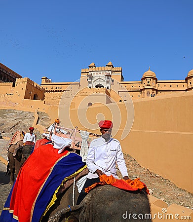 Amer Fort or Amber Fort. Decorated elephants and elephant riders waiting for tourists Editorial Stock Photo