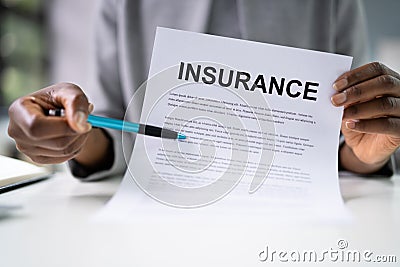 American African Agent Showing Company Insurance Policy Stock Photo