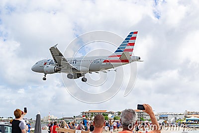 American Airlines aircraft Airbus 319 preparing to land at SXM Editorial Stock Photo
