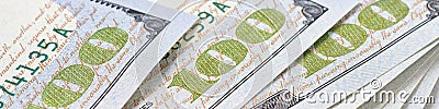 American banknotes of one hundred dollars. Fragment of bills close-up. Money banner or headline. Focus on the number 100. Economy Stock Photo