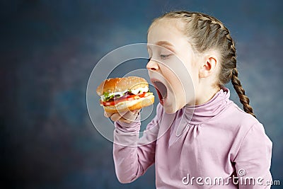 American calories fat meal Junk food, Little Girl enjoy eating hamburgers fast food burger unhealthy Stock Photo