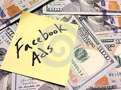 American cash money and yellow paper note with text Facebook Ads Editorial Stock Photo