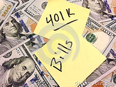 American cash money and yellow paper note with text 401K and Bills Stock Photo