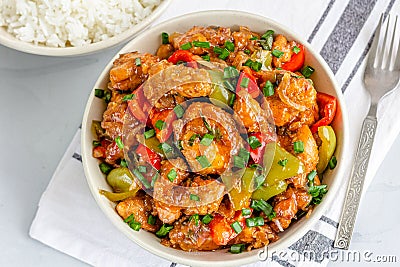 American Chinese Cuisine, Sweet and Sour Chicken Directly from Above Photo. Sweet and Sour Chicken on a Bowl on White Background Stock Photo