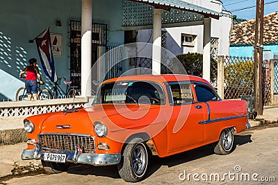 American classic car in Cuba with the national flag from Cuba Editorial Stock Photo