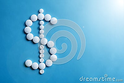 American dollar sigh made of white round pills. Pharmacy background. Wealth concept. Stock Photo