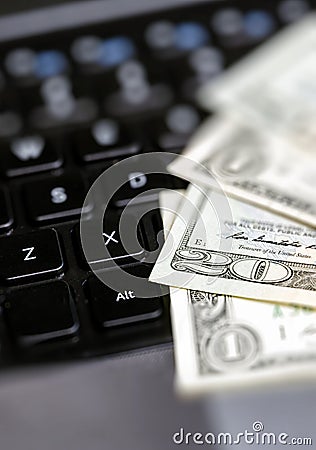 American dollars money and laptop computer Stock Photo
