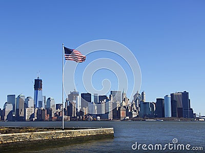 American flag against Manhattan skyline Stock Photo