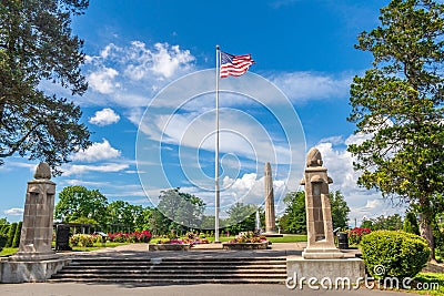 American flag at the entrance to the Walnut Hill Park rose garden. Editorial Stock Photo