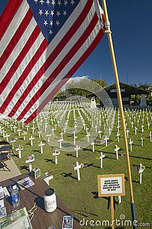 American flag at mock cemetery honoring 1500+ Iraqi servicemen killed in Iraq War, Ventura California Editorial Stock Photo