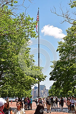 American flag on a very tall pole on Liberty Island Editorial Stock Photo