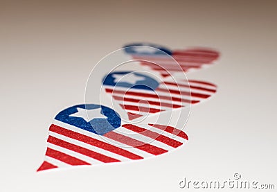 American flags heart shaped. Love icon of the american flags. In memoriam of 4th of July with patriotic USA flags heart shaped. Stock Photo