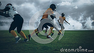 American Football Field Two Teams Play: Successful Player Running Around Defense Players to Score Stock Photo