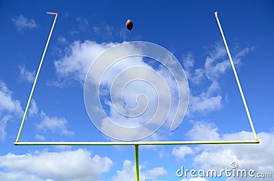 American Football and Goal Posts Stock Photo