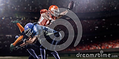 American football player in action on stadium Stock Photo