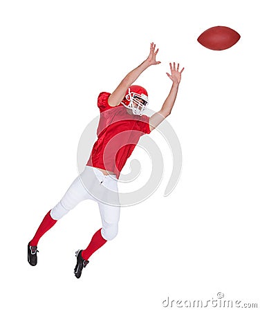 American Football player catching ball Stock Photo