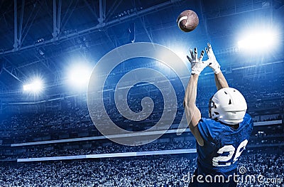 American Football Player Catching a touchdown Pass Stock Photo