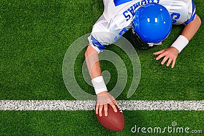 American football player one handed touchdown Stock Photo