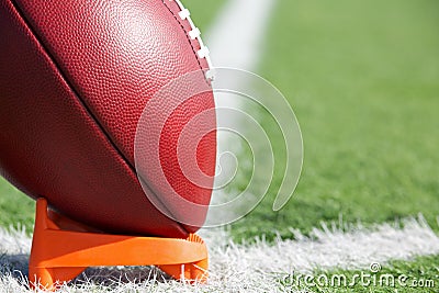 American Football teed up for kickoff Stock Photo