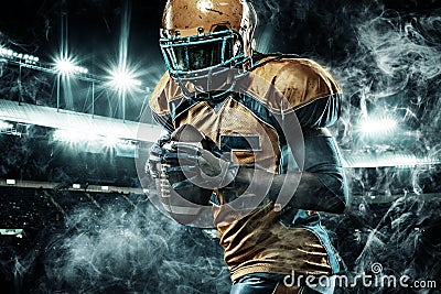 American football sportsman player on stadium running in action Stock Photo