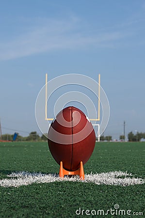 American Football teed up for kickoff Stock Photo