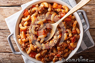 American goulash made from pasta with tomatoes, spices and ground beef close-up. horizontal top view Stock Photo