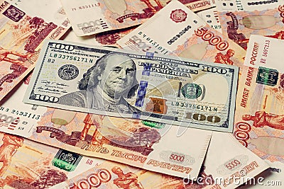 American hundred dollars on the background of Russian 5000 rubles Stock Photo