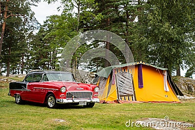 American muscle car Chevrolet BelAir in a camp with a retro tent in Halden, Norway Editorial Stock Photo