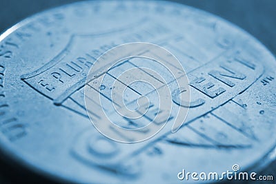 American 1 one cent coin very close-up. Light blue tinted background or wallpaper on an economic, financial, banking theme. Stock Photo