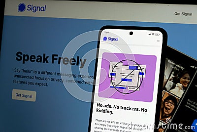 American open-source, encrypted messaging service Signal app on mobile app in front of desktop version on March 28, 2025 in Prague Editorial Stock Photo