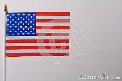 American patriotic little flag lies on the table, background Stock Photo