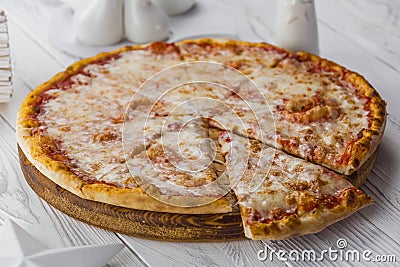 American pizza with pepperoni, mozzarella and tomato sauce Stock Photo