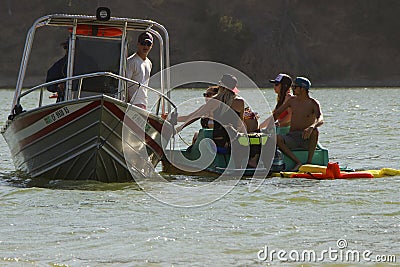 American rescue motor boat tows a catamaran with passengers Editorial Stock Photo