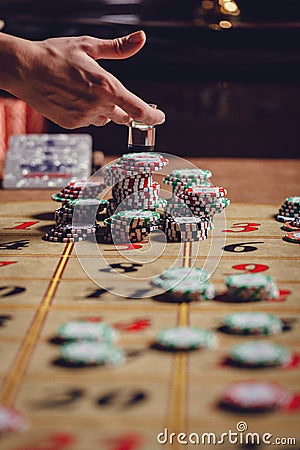 American roulette table, the dealer puts Dolly on the winning number Stock Photo