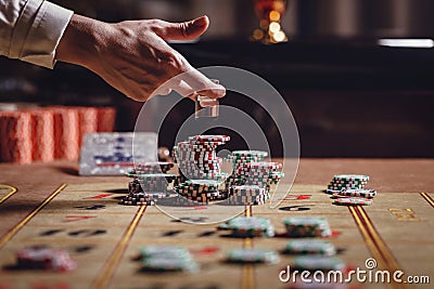 American roulette table, the dealer puts Dolly on the winning number Stock Photo