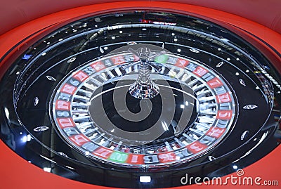 American roulette table, playing. Roulette wheel spinning clockwise rotation, tourelle Stock Photo