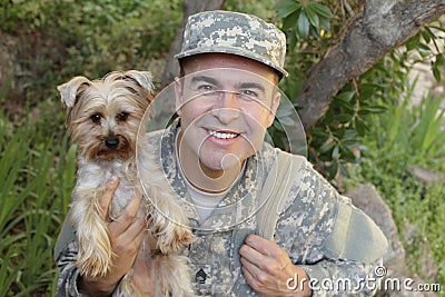 American soldier being welcomed by his dog Stock Photo