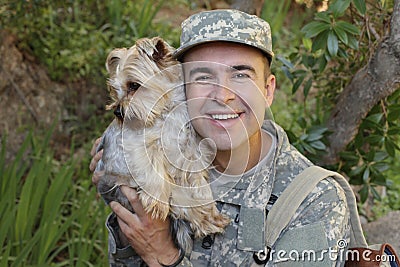 American soldier being welcomed by his dog Stock Photo