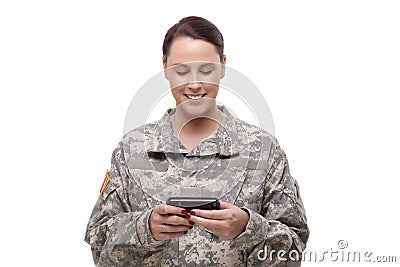 American soldier reading a text message Stock Photo