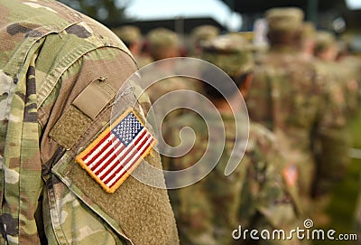 American Soldiers and Flag of USA on soldiers arm. US Army. Veteran Day Stock Photo