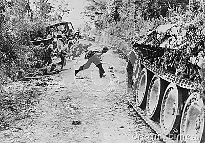 American soldiers race across a dirt roadnear St. Lo, in Normandy, France, on July 25, 1944. Editorial Stock Photo