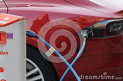 AMERICAN TESLA ELECTRIC CAR AT CHARGE POINT Editorial Stock Photo