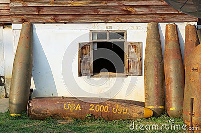 American unexploded bombs located outside of a residential building in Phonsavan, Laos. Editorial Stock Photo